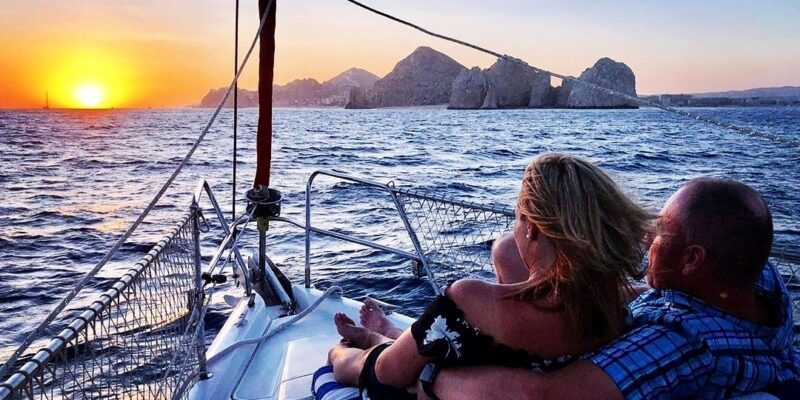 a person sitting in a boat on a body of water